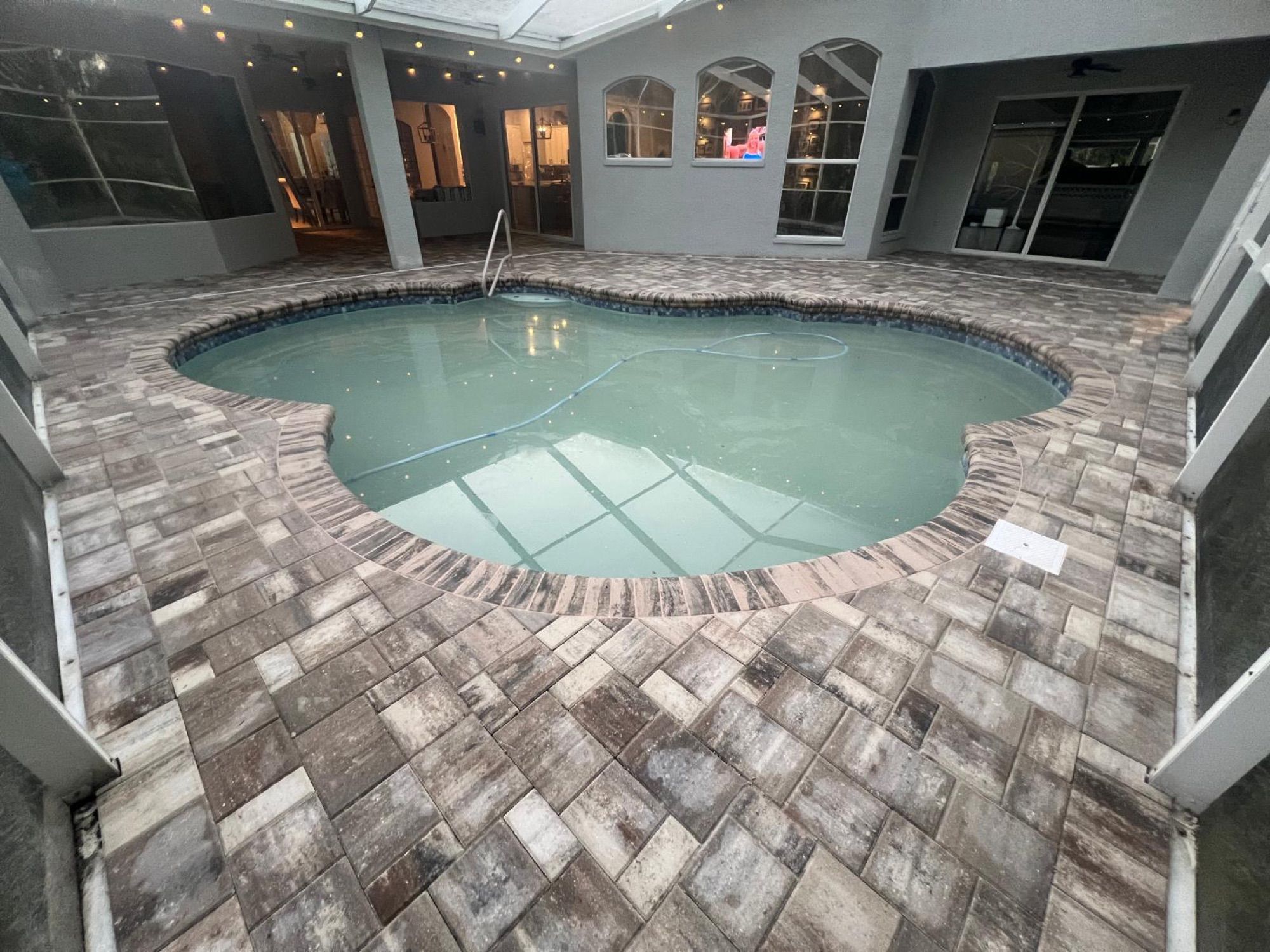 Custom travertine pool deck by Evolution Pro Pavers in Tampa, FL